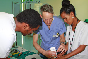 David Nelson teaching two of the Gamby Hospital staff nurses splint forming techniques.