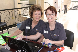 Mission Director Jean Bird (left) with Deb Nolan at the admissions desk.